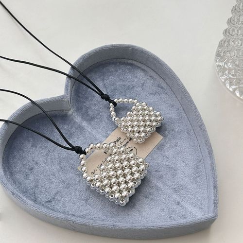 A handmade copper bead necklace with a vintage and unique design, featuring a long pendant shape inspired by Korean blogger accessories.