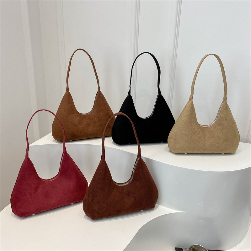 Bolsa de mano de textura retro coreana para mujeres 2025 primavera nuevo estilo de viaje al trabajo molido bolso de hombro axilla
