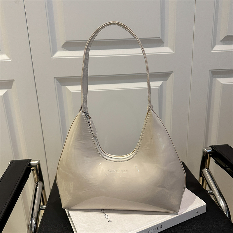 Moda casual axila media luna bolso de mujer charol bolso de hombro portátil estilo caliente Europa y América retro brillante sensación de alta gama