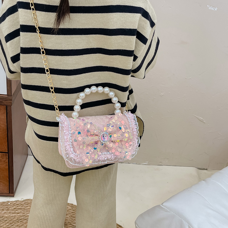 Primavera y verano nueva celebridad en línea bolso de los niños moda Chanel estilo princesa bolsa pequeña niña linda bolsa de mensajero portátil al por mayor