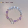 Pink-purple bracelet with bow