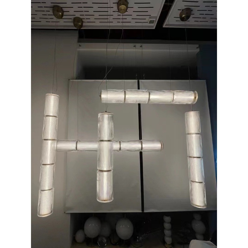 Nuevo diseño lujoso minimalista atmósfera dormitorio lámpara de cabezal de cama una palabra de vidrio largo lámpara de comedor moderna simple