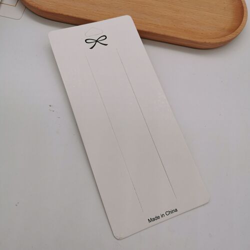 A pack of approximately 100 white hair clip earring ear stud cardboard hair tie necklace packaging card square card tag paper card