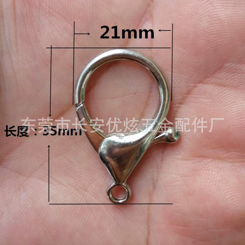 Fábrica directa de aleación de zinc bobina de perro botón de puerta botón de langosta cadenas de perlas campanas 304 llaveros de acero inoxidable