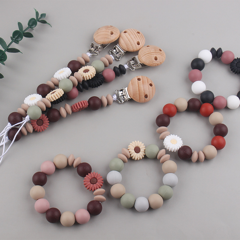 Nueva margarita pequeña cadena de tetina para calmar a los bebés anti-caída cadena creativa DIY pulsera de goma de diente dos conjuntos