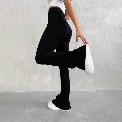 High-waist elastic long pants with a fitted, ribbed, and slightly flared casual design