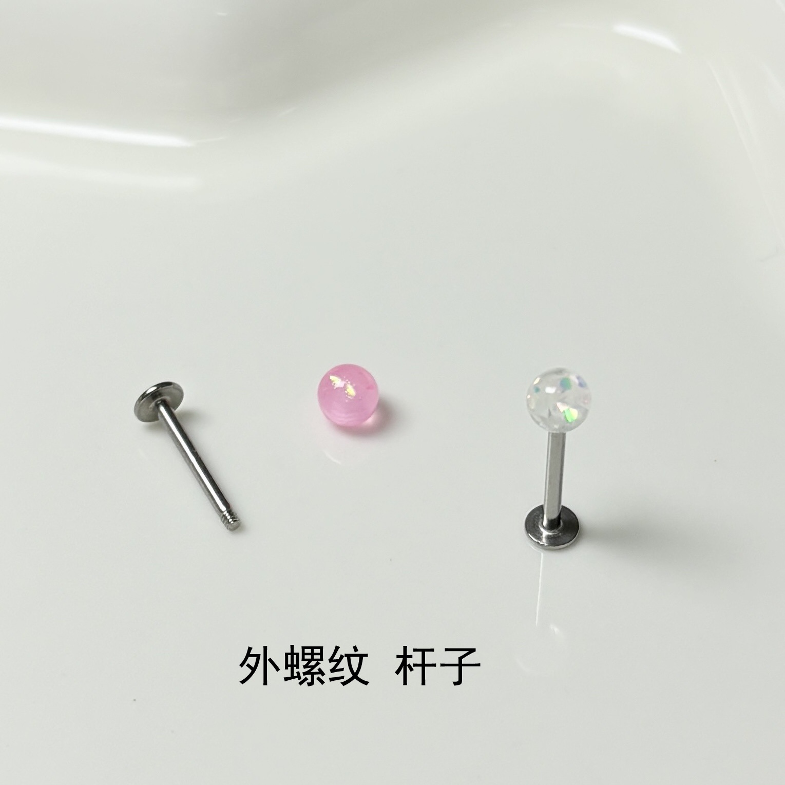 Silver pointed spike labret stud material detail