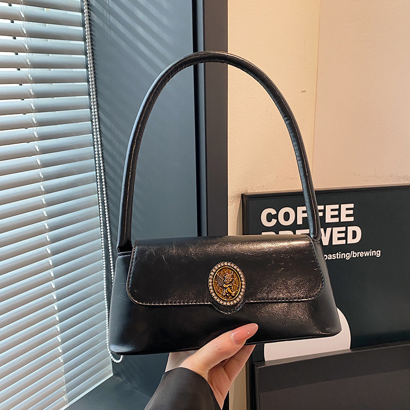 Bolsos retro de estilo extranjero para mujeres otoño y invierno 2024 nuevo estilo de moda bolsas de brazo de diseño de nicho bolsas de hombro