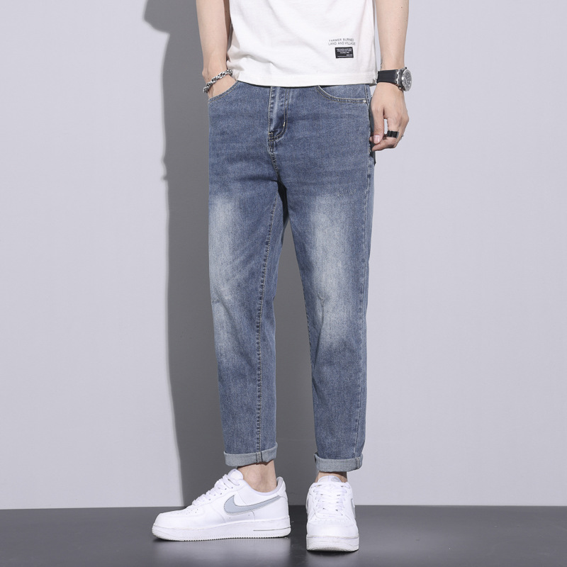Pantalones vaqueros blancos lavados vintage de la estación europea de los hombres nuevos pantalones largos de los hombres elásticos flojos de moda del todo-fósforo