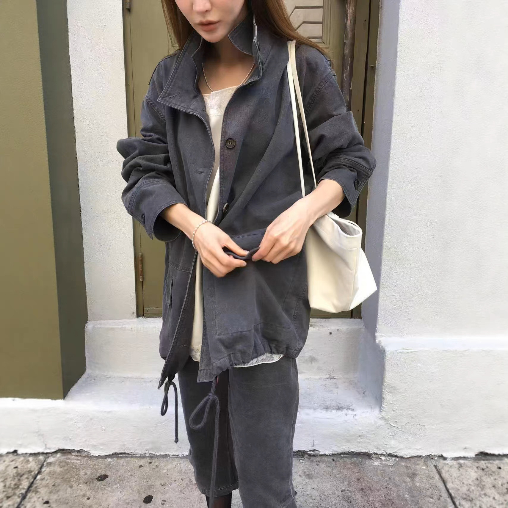 In-stock Korean Dongdaemun 2026 Autumn New Solid Color Patchwork Pocket Long Sleeve Drawstring Jacket Casual Coat