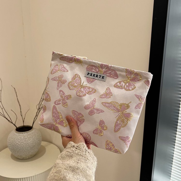 Bolsa de maquillaje de mariposa transfronteriza pequeña bolsa fresca portátil de cuidado de la piel bolsa de almacenamiento bolsa de lavado de viaje bolsa de lona bolsa de mano