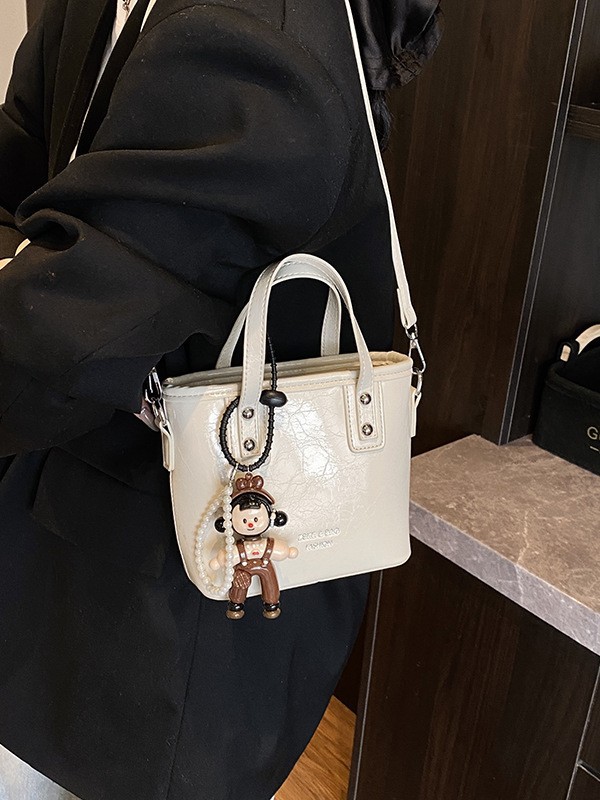 2025 nuevo nicho de moda bolso de cubo de mano para mujeres estilo coreano simple versátil bolso de hombro de moda mochila casual
