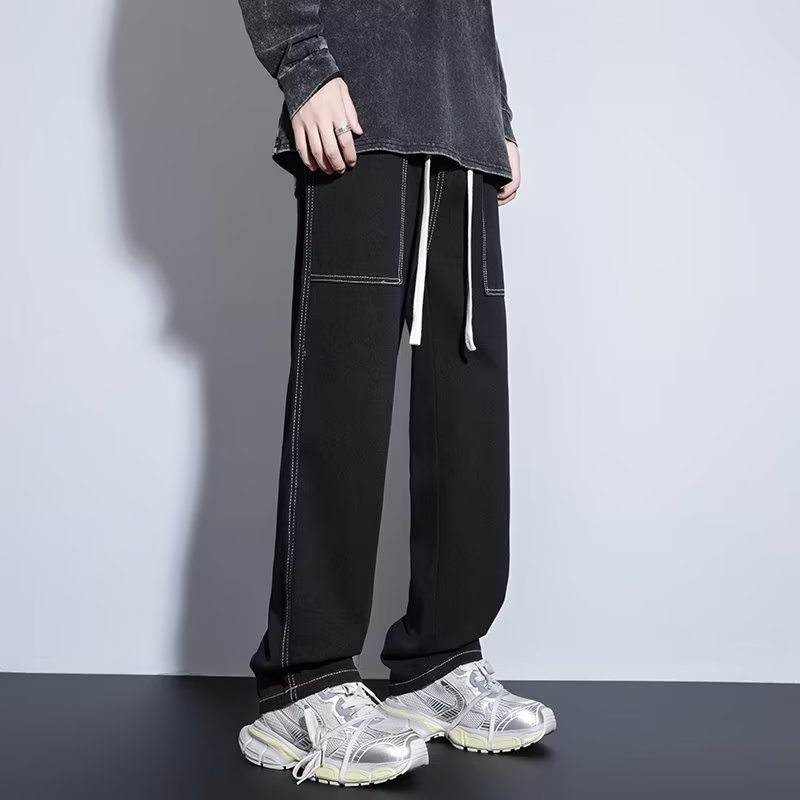 Pantalones casuales de primavera y otoño para hombres, estilo suelto de Hong Kong, sarga, pantalones de trapeador de pierna ancha de arte de moda, jeans deportivos