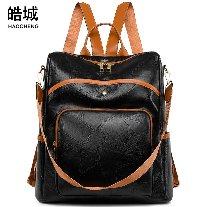 Comercio exterior al por mayor 2024 nuevo estilo cuero suave de gran capacidad mochila retro europea y americana moda color de contraste mochila de doble uso mamá