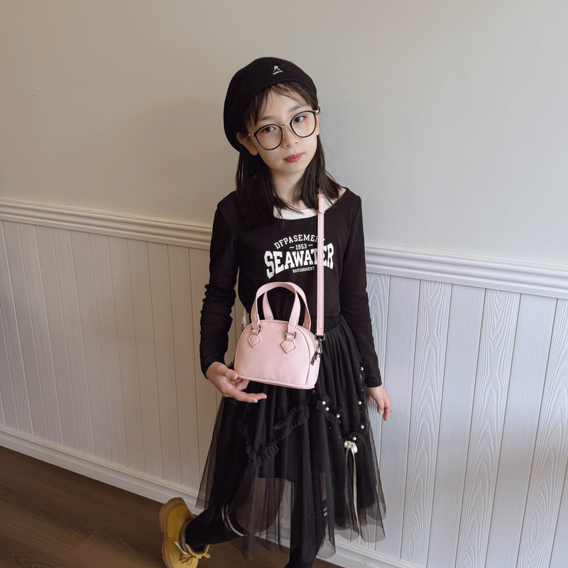 Moda coreana de color sólido bolso de hombro para hombres y mujeres, mini lindo bolso de concha de bebé 2025 nuevo bolso de mano para niños
