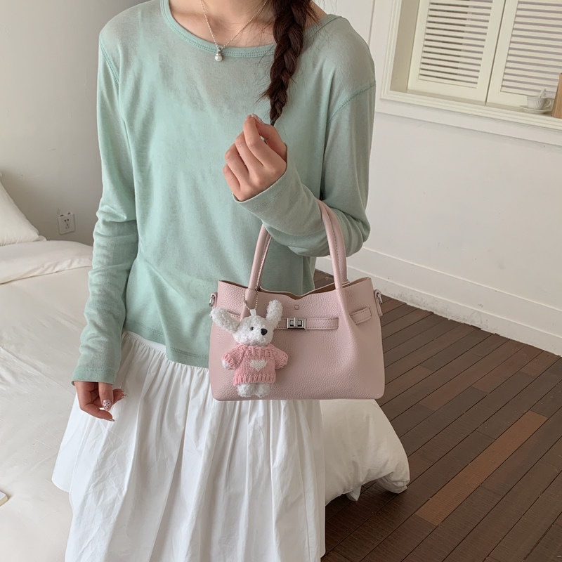 Simple portátil 2026 diseño de bolso de hombro único versátil estilo coreano de transporte de moda nuevo bolso de cubo nicho femenino