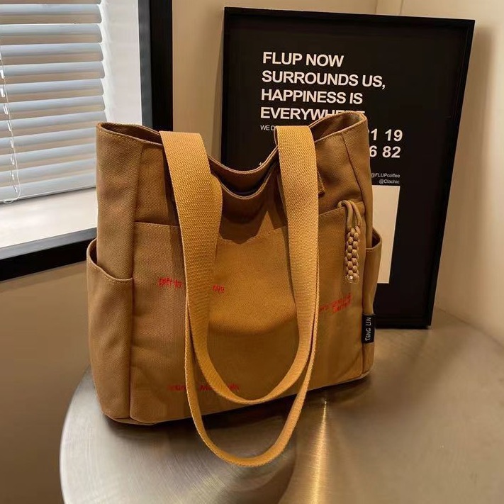 Bolsa de mano ligera para mujeres en clase de hombro único bolso de lienzo con cremallera de estilo coreano