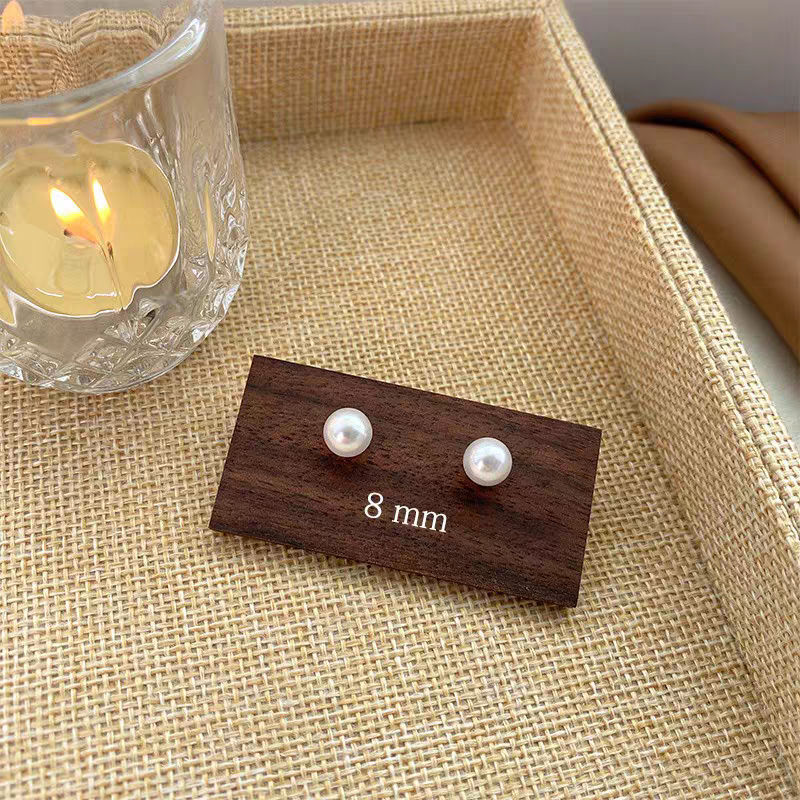 Pendientes de aro lisos para mujer, lujo ligero, pendientes de alta gama, pendientes populares, aretes de diseño exclusivo, aretes de otoño e invierno al por mayor