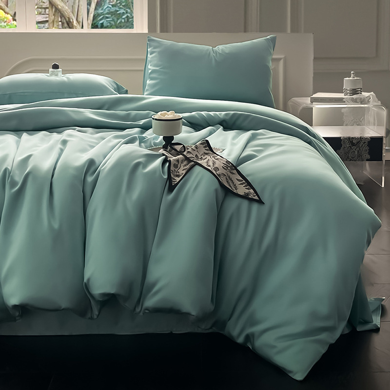 Juego de cama de verano de cuatro piezas de seda de hielo de lujo ligero 2025 nueva funda de edredón sábana sábana sábana ropa de cama desnuda sedosa