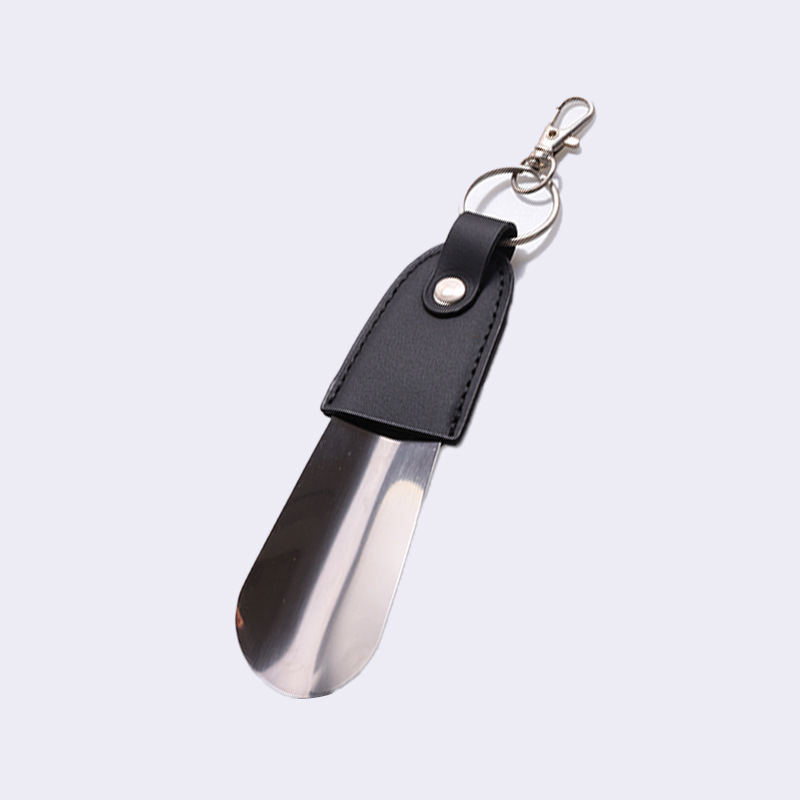 Inventario al por mayor de acero inoxidable llaver de zapato de tirador de cuero funda de zapato portátil de tirador de zapato de coche llave colgante elevador de zapato