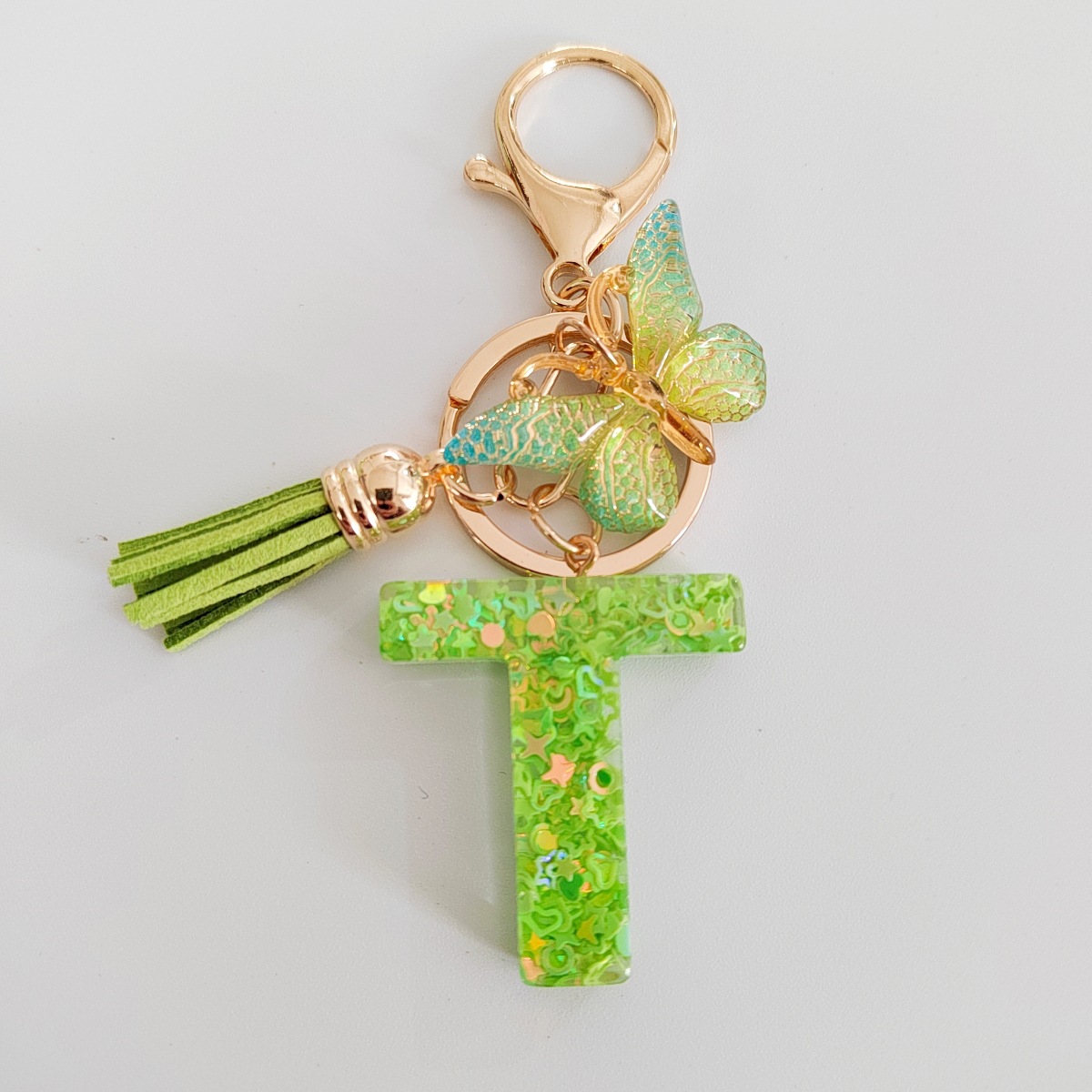 26 letras inglesas llavero colgante estrella verde brillo gota resina colgante llavero de personalidad europea y americana