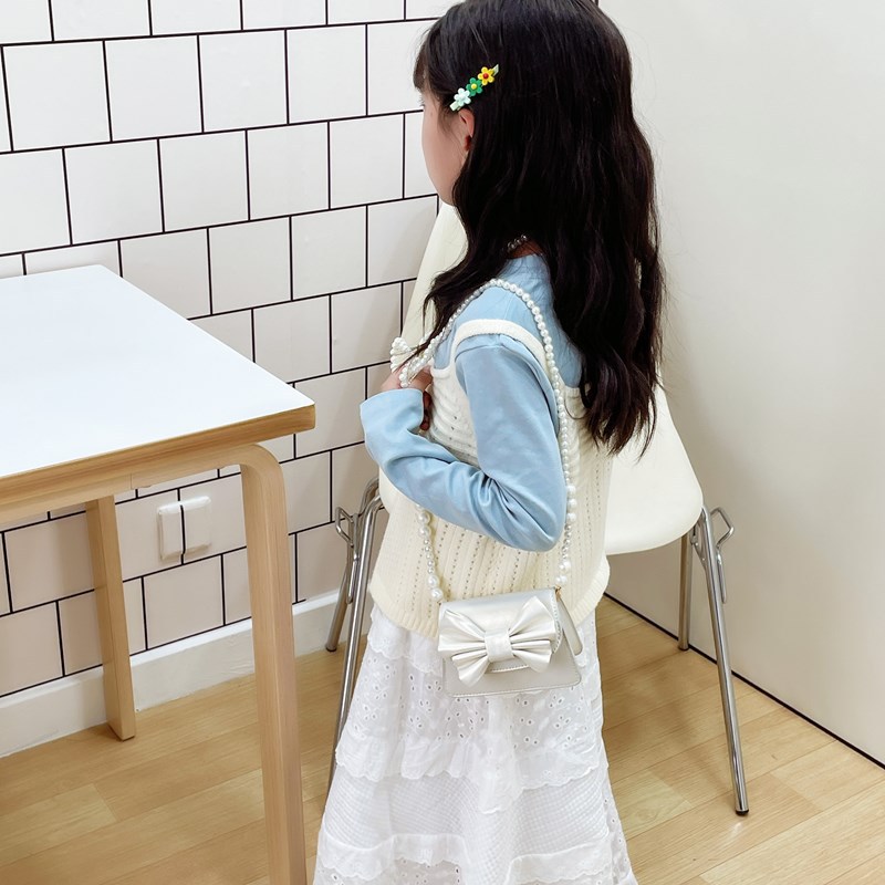 Coreano estilo extranjero mini niñas bolso de hombro lindo arco bebé mochila nueva moda bolso de cadena para niños