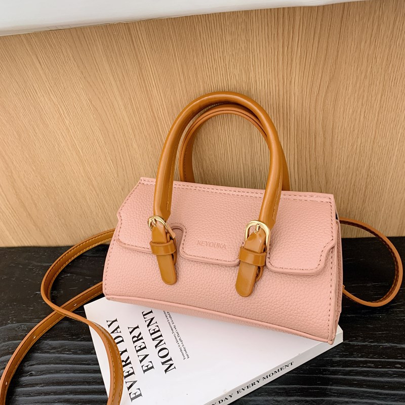2025 nuevo bolso para niños de comercio exterior, bolso de niña popular de moda coreana, bolso de mensajero para bebé de color sólido de estilo extranjero