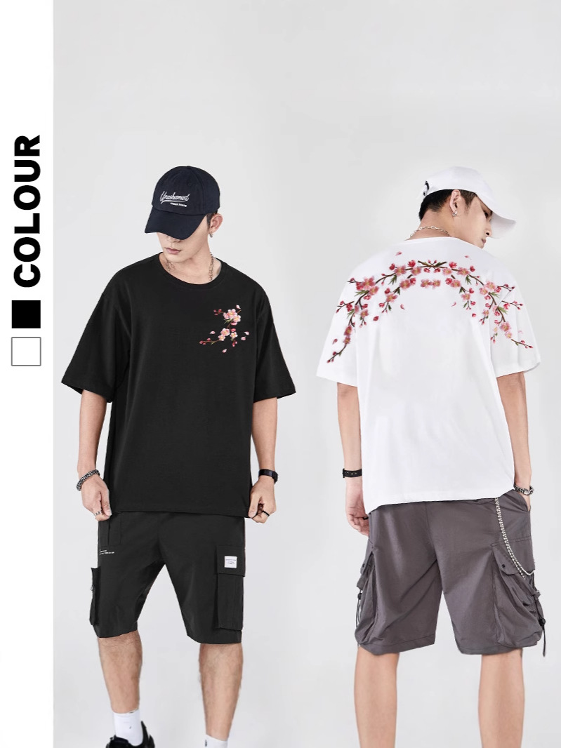 2025 primavera y verano nueva marea nacional marca de moda china suelta flor de ciruelo bordado camiseta de manga corta pareja masculina media manga de verano