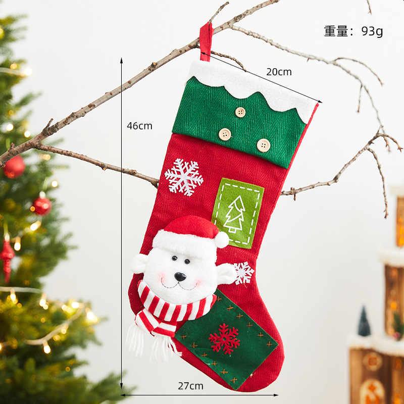 クリスマスの靴下のプレゼントの袋の大きいサイズの老人の雪だるまの贈り物のキャンディーの靴下のシーンは飾りを掛けてクリスマスの装飾品を飾ります。|undefined