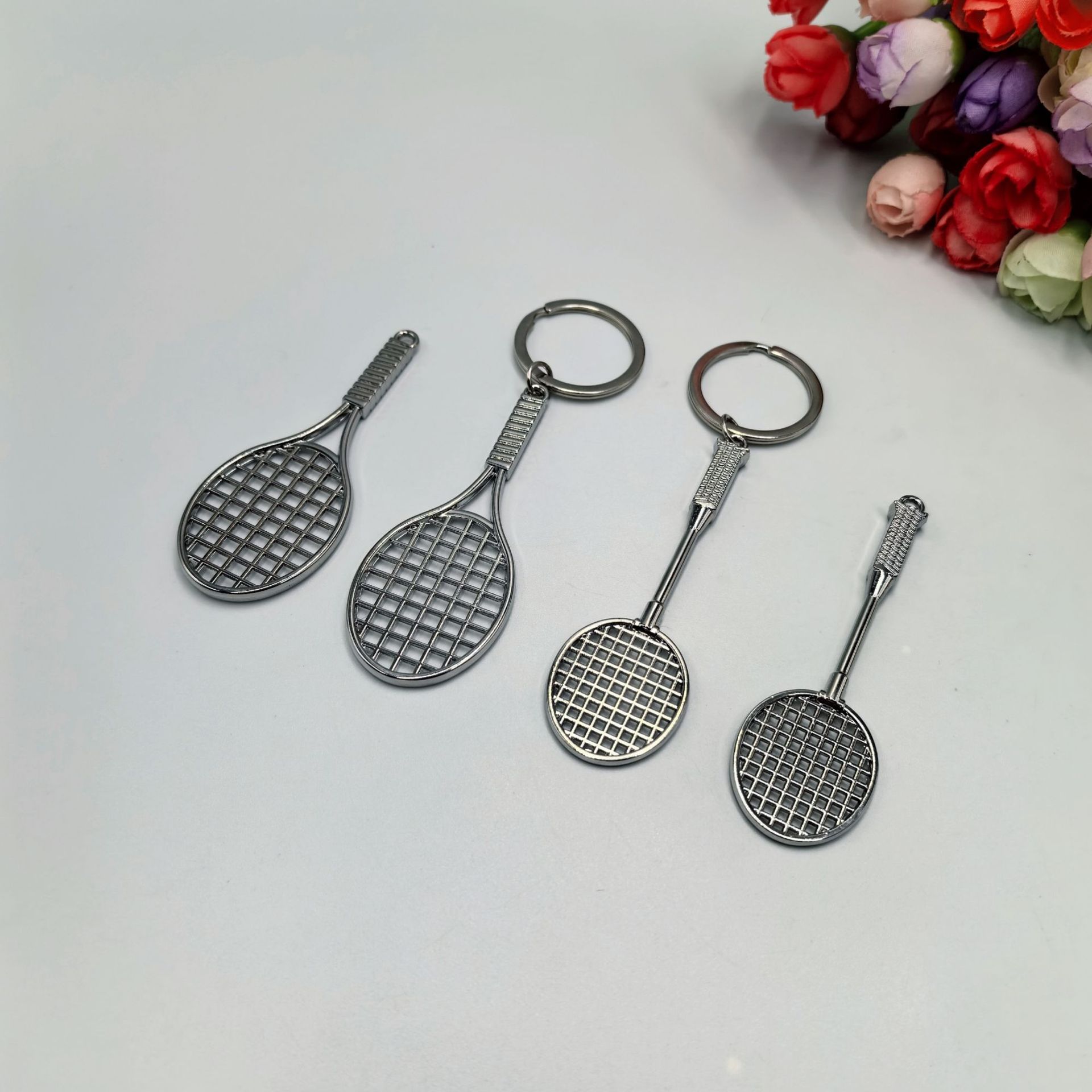 Raquetas de tenis de aleación de zinc raquetas de bádminton colgantes bolsas escolares colgantes de fanáticos pequeños regalos deportivos transfronterizos