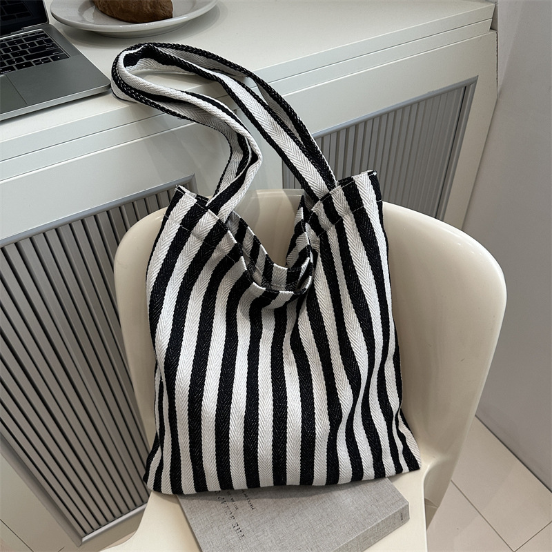 Bolsa de lona a rayas coreana simple bolso de hombro de estudiantes de literatura y arte gran capacidad de lazo bolso de mano