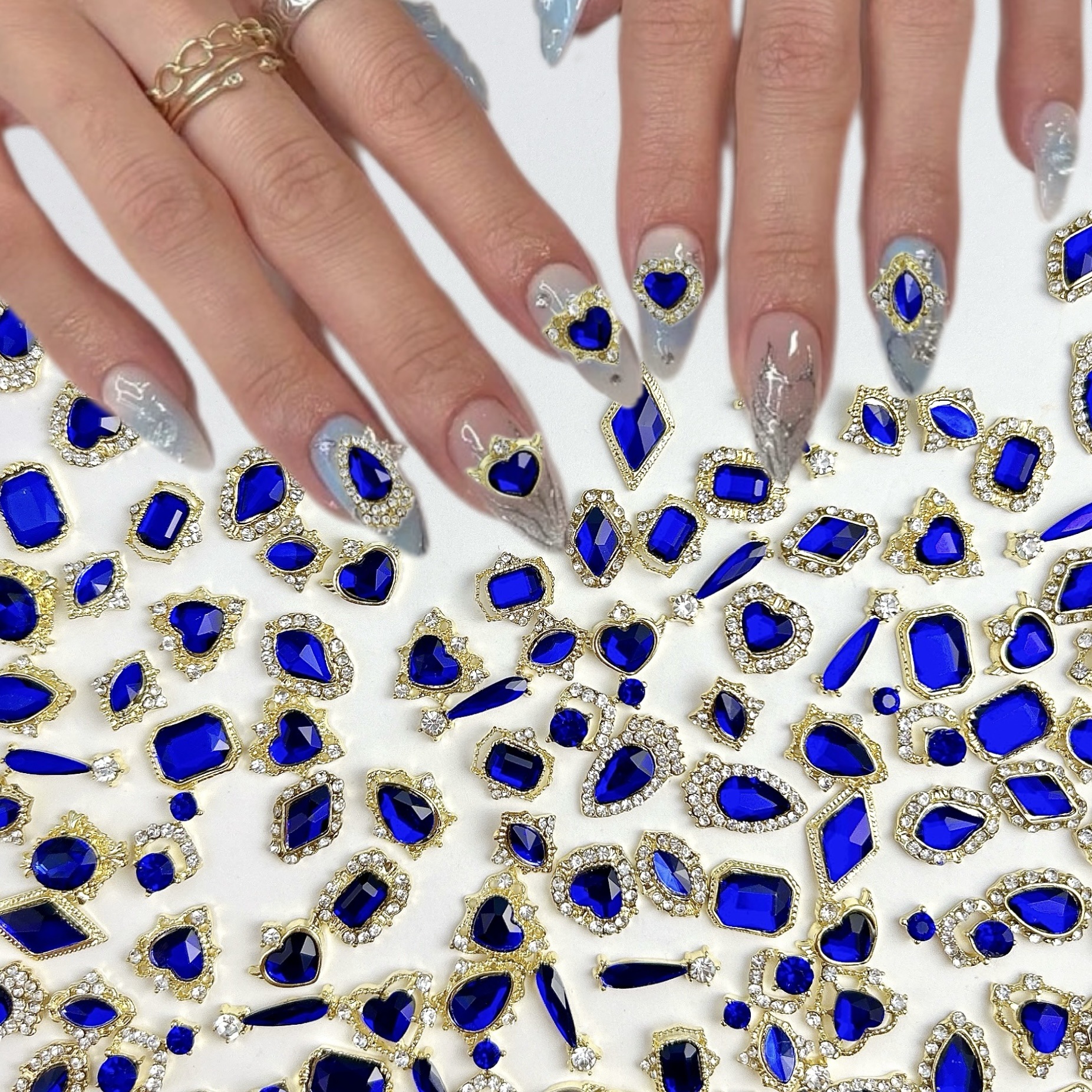Nueva aleación china joyas de manicura taladro explosión grasa flash Fang amor gota de agua XiFeiYuan la misma armadura de la corte con taladro