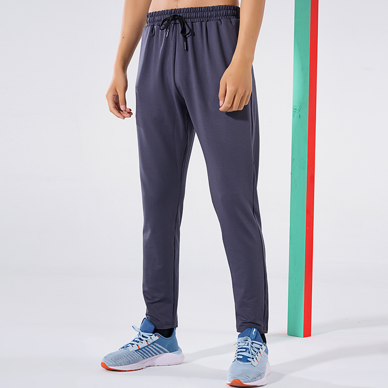 Primavera y otoño de los hombres al aire libre corriendo Pantalones deportivos de secado rápido transpirable flojo más tamaño casual estiramiento pantalones en stock impreso NK