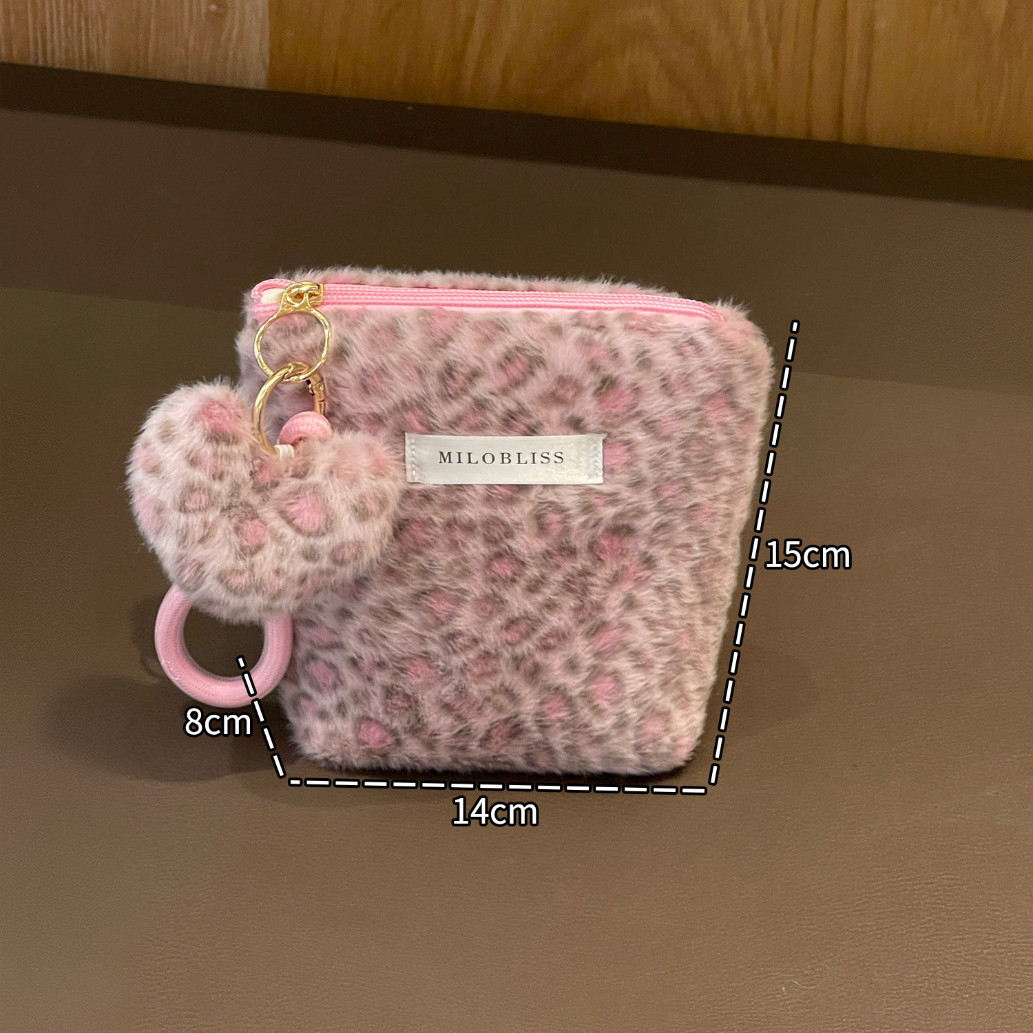 Nueva bolsa de maquillaje impresa de leopardo de peluche de pelo de conejo multifuncional portátil otoño y invierno para salir bolsa de almacenamiento de lavado de gran capacidad