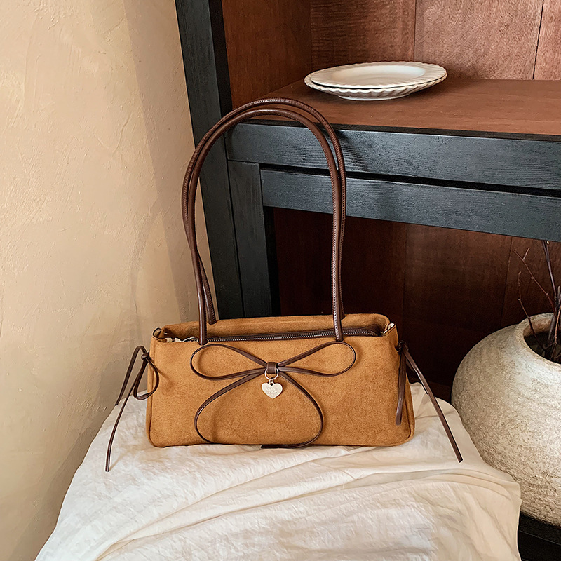 Korean-style, ultra-popular, niche bow-knot underarm bag for women, autumn retro, minimalist, commuting, high-end single-shoulder baguette bag