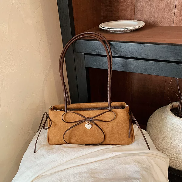 Korean-style, ultra-popular, niche bow-knot underarm bag for women, autumn retro, minimalist, commuting, high-end single-shoulder baguette bag