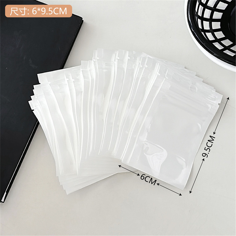 Colección de bolsas opp transparentes, cabeza de tarjeta, bolsa de embalaje trasera, bolsa de joyería pequeña, bolsa autoadhesiva con orificio colgante, bolsa de embalaje de plástico al por mayor