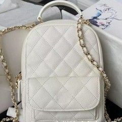 高バージョンの新型の小香風miniレイシの紋様の牛革のカエルの肩のリュックサックの小さいかばんの手提げの斜め掛けの女性のカバン