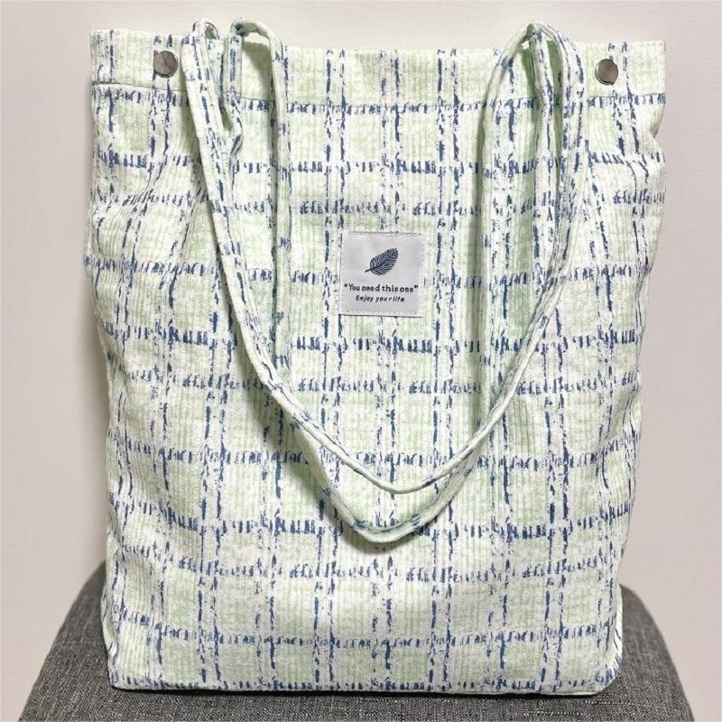 Versión coreana del bolso de lona de pana, bolso de almacenamiento portátil, bolso femenino, bolso de hombro de todo fósforo literario de gran capacidad, spot femenino al por mayor