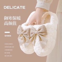 新型保温蝶結び綿のスリッパ秋冬の厚い底の滑り止めの家のぬいぐるみのカップルは家庭用月子綿の靴の女性を引っ張ります。