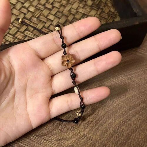 New Chinese-style retro wooden carved small peach blossom bracelet, women's peach wood braided cord, niche design, versatile national trend jewelry