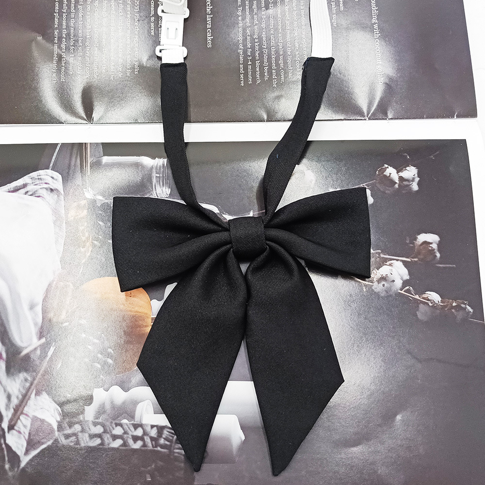 Spot al por mayor versión estrecha niña pequeña pajarita de raíz de plumas pajarita flor moda nuevo lazo color sólido jk pajarita satinado