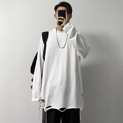 Basic shirt with a distressed hem, white long-sleeve T-shirt—men's Instagram-worthy high-street style for layering and edgy, stacked-look outfits.