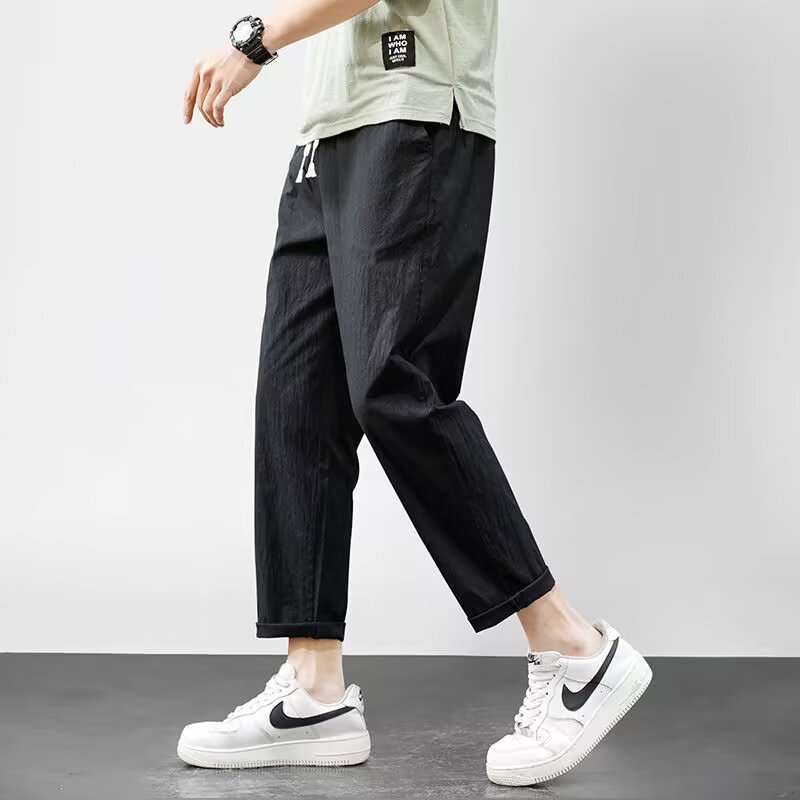 Pantalones casuales para niños otoño nueva marca de moda ropa de trabajo recta suelta nueve puntos pantalones largos deportivos 2025 primavera y otoño ropa de hombre
