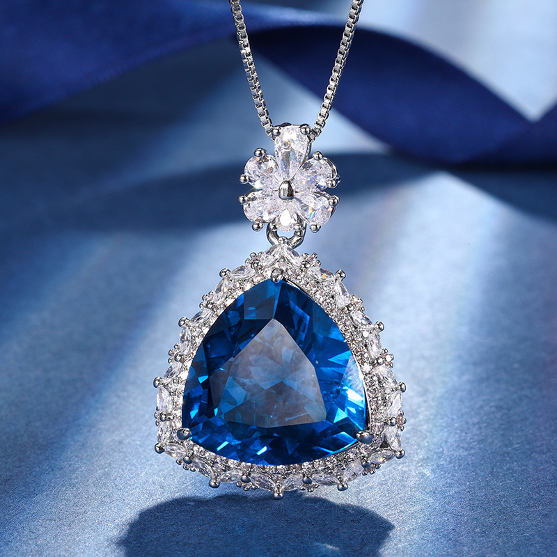 El otoño y el invierno Nueva Zhuang Sheng joyas de cobre de fondo chapado en oro de simulación azul de cristal puntiagudo traje avanzado 17*17-12*12