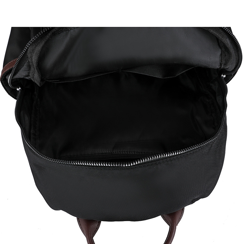 Venta al por mayor transfronteriza 2024 invierno nuevo estilo casual damas mochila de nailon simple y versátil mochila de viaje ligera marea