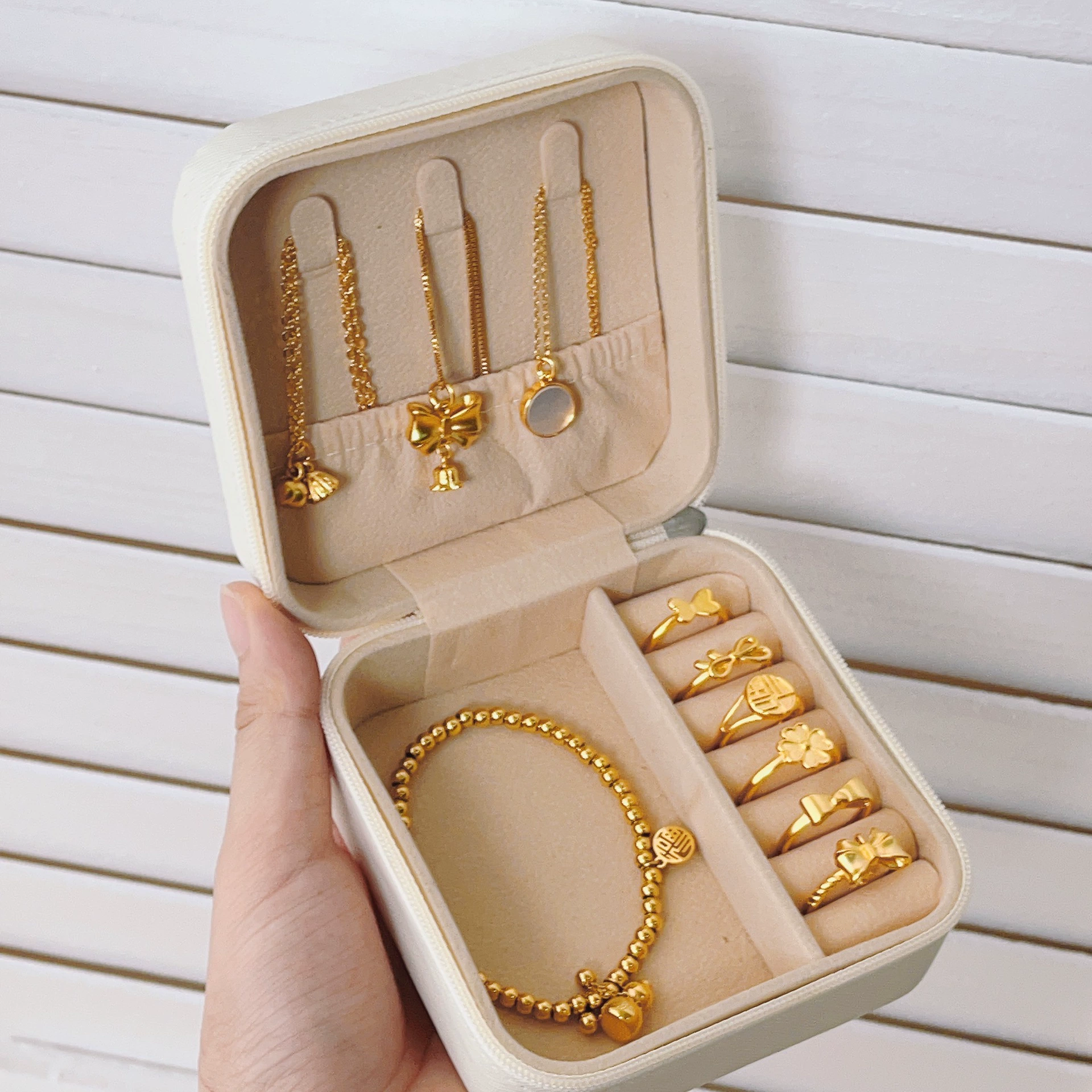 Handheld storage system, storage box, earrings, jewelry, accessory, necklace, small ring