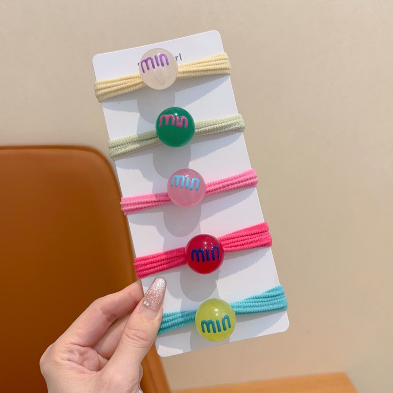 Las muchachas de la cuerda del pelo del color del caramelo no hacen daño al pelo pequeña tira de goma Lazo de la cuerda del pelo tocado niños lindos cubierta de cuero de la banda del pelo del bebé