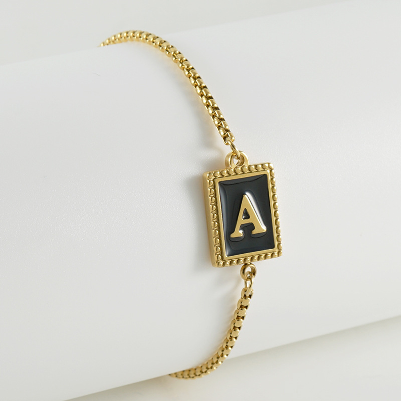 La moda europea y americana transfronteriza del acero inoxidable 26 pulsera inglesa de la letra en relieve pulsera Titanium de la cremallera del acero 18K de la frontera para las mujeres