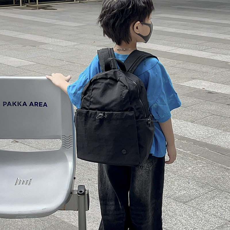 Mochila escolar de gran capacidad para estudiantes de primaria, color sólido simple, mochila casual ligera para niños y niñas 2025 nueva mochila para niños